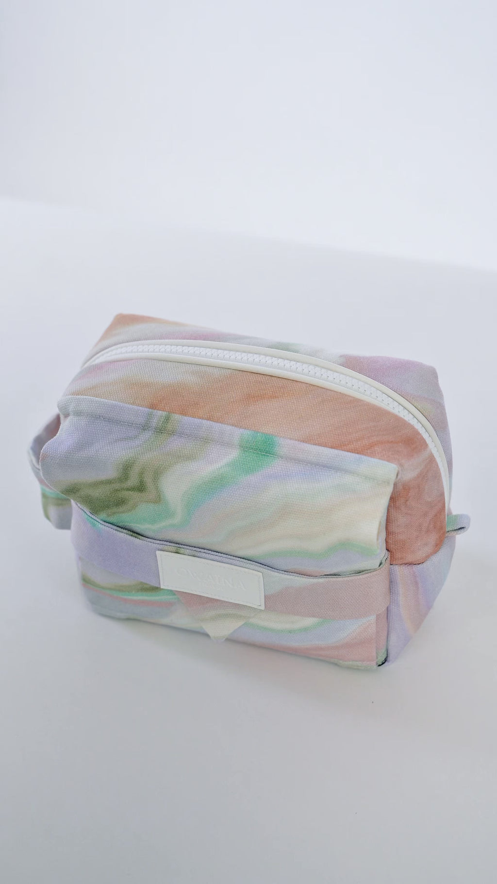 Vidéo trousses de toilette pastel Owaïna avec fermeture zippée sur fond blanc